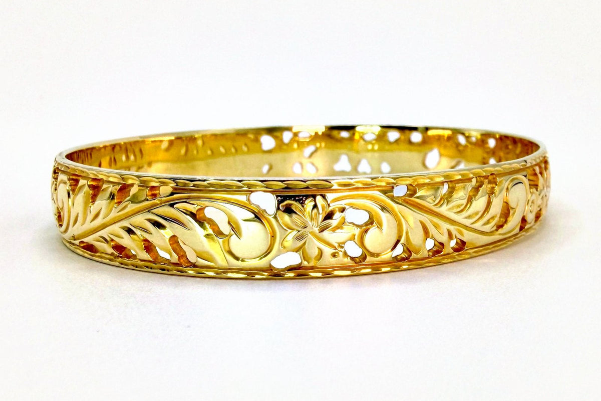 Aloha Pauahi gold Hawaiian heirloom bangle with open hand engraved leaf scrollwork, handcrafted by Jewel Box Hawaii.