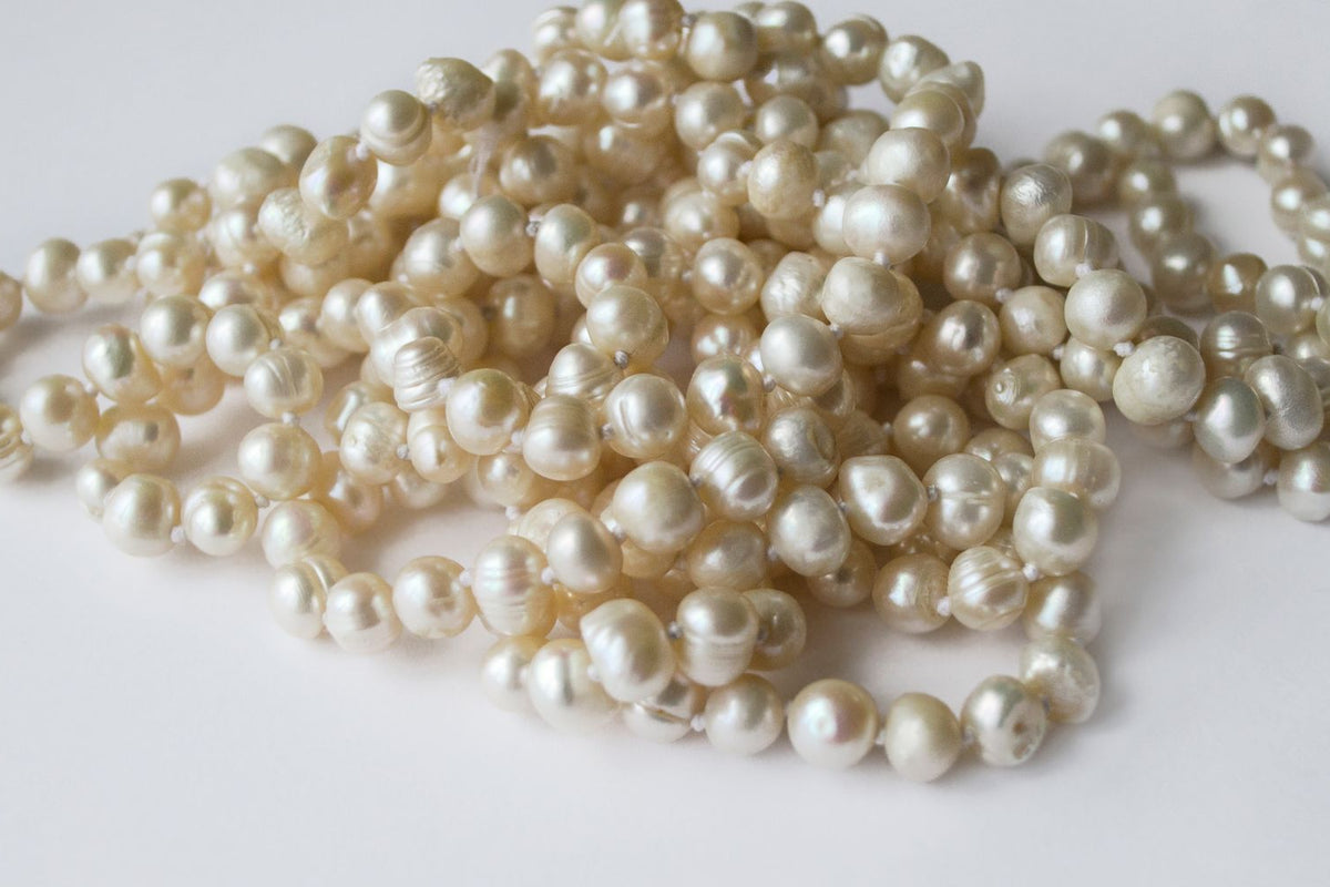 Strands of lustrous white freshwater pearls, June's birthstone