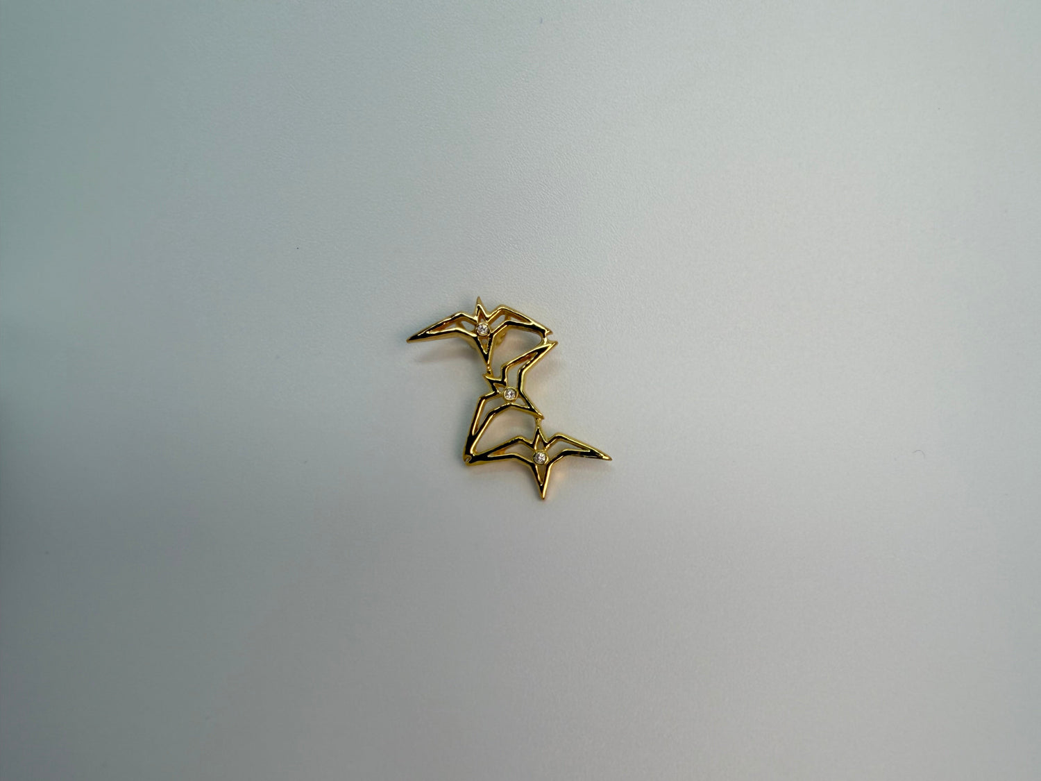 Gold geometric diamond-cluster pendant, handcrafted by Jewel Box Hawaii, Honolulu.